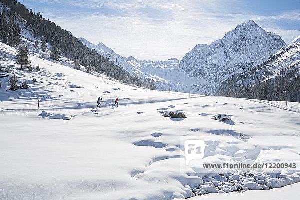 Austria  Tyrol  Luesens  Sellrain  two cross-country skiers in snow-covered landscape