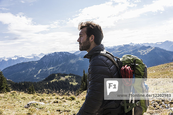 Austria  Tyrol  young man in mountainscape looking at view