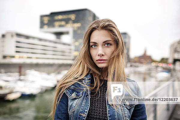 Portrait of attractive young woman at city harbor