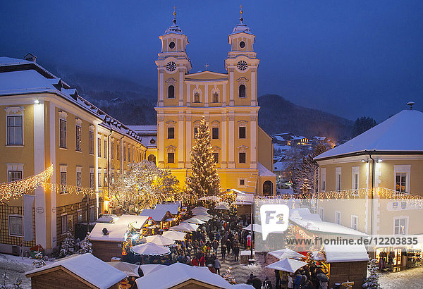 Austria  Salzkammergut  Mondsee  View of Basilica of St. Michael  christmas market at night