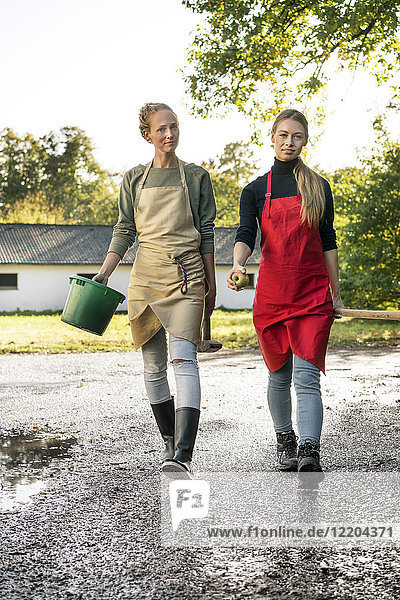 Two women working on a farm