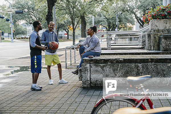 Black friends with basketball hanging out