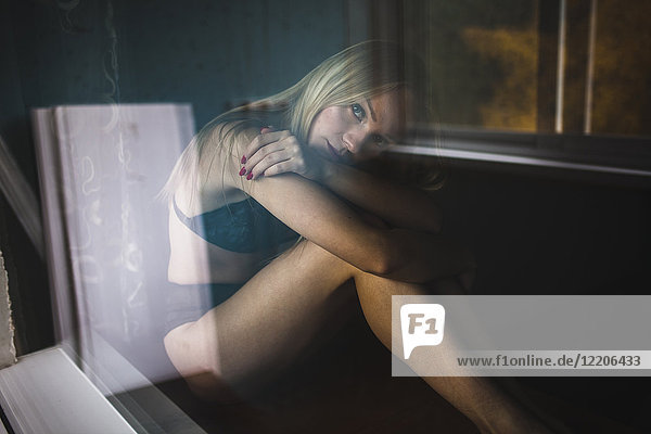 Close up of pensive Caucasian woman resting near window