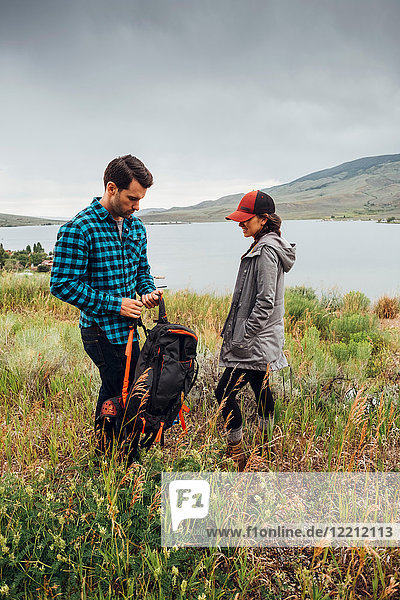 Couple standing beside Dillon Reservoir  Silverthorne  Colorado  USA