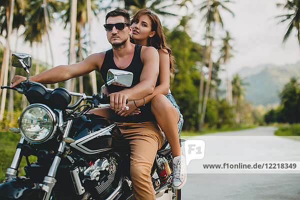 Young couple riding on motorcycle on rural road  Krabi  Thailand