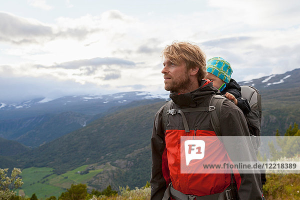 Male hiker with son in mountain landscape  Jotunheimen National Park  Lom  Oppland  Norway