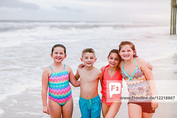 Portrait of boy and three girls on beach  Dauphin Island  Alabama  USA