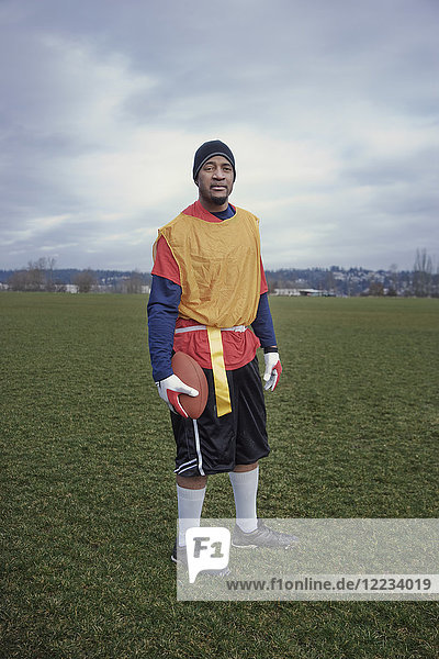 Black man member of an American flag football team.