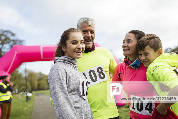 Happy family runners at charity run