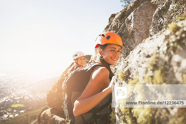 Portrait smiling female rock climber