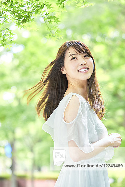 Attractive Japanese woman in a city park