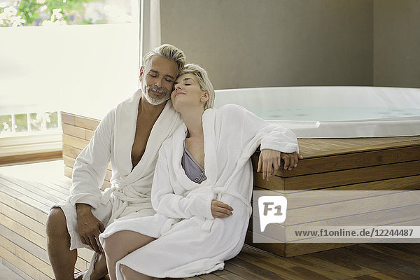 Couple in bathrobes relaxing at spa