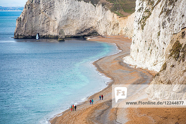 Tourists on Durdle Door beach on the Jurassic Coast  UNESCO World Heritage Site  Dorset  England  United Kingdom  Europe