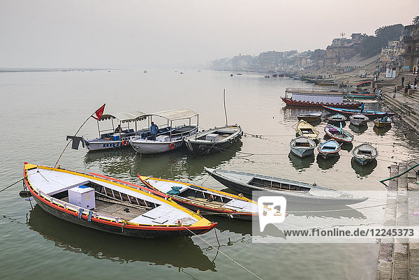 Boats in the mist at dawn on the River Ganges  Varanasi  Uttar Pradesh  India  Asia