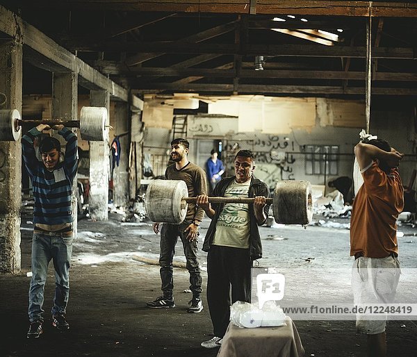 Refugees  Afghani  Pakistani youth  abandoned department store  Belgrade  Serbia  Europe