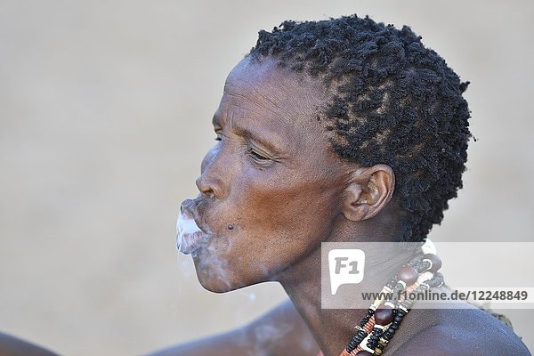 Old San woman smoking  portrait  Bushman tribe  Kalahari  Namibia  Africa
