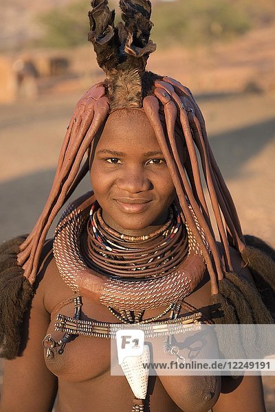 Young  married woman with headdress and necklace  portrait  Kaokoveld  Namibia  Africa