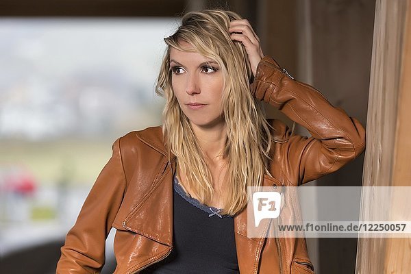 Woman blond with brown leather jacket  Fashion  Portrait  Lifestyle