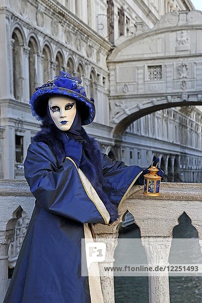 Female disguised with Venetian mask in front of Bridge of Sighs  Carnival in Venice  Italy  Europe