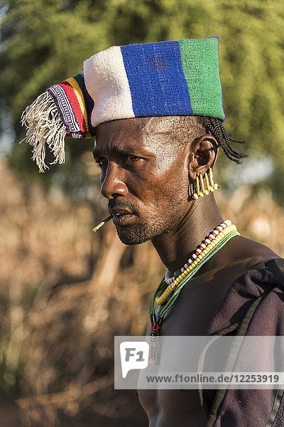 Man with colorful headgear  Hamer tribe  Turmi market  Southern Nations Nationalities and Peoples' Region  Ethiopia  Africa