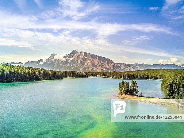 Minnewanka Lake with small peninsula with trees  Banff National Park  Alberta  Canada  North America