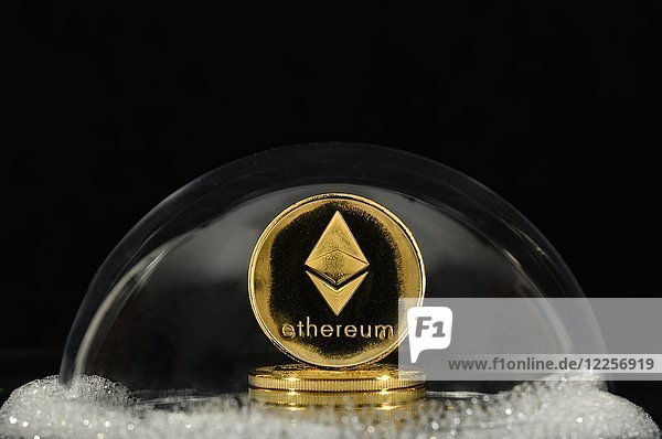 Symbol image bubble  stock market crash  Cryptocurrency  digital currency  golden coin Ethereum