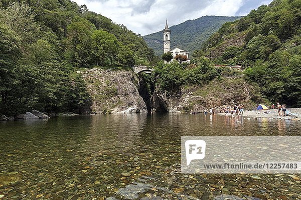 River Cannobino with bathing place at the end of the gorge of Sant' Anna  in the baclground the church of Orrido Sant' Anna  Cannobio  Verbano-Cusio-Ossola province  Piedmont region  Italy  Europe