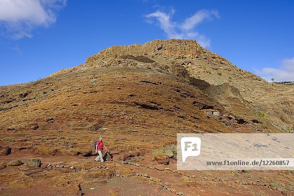 Woman hiking on trail  Calvario near Alajero  La Gomera  Canary Islands  Spain  Europe