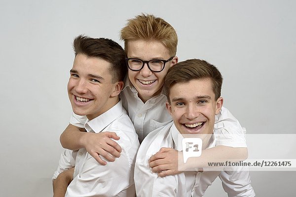 Three young men  laughing