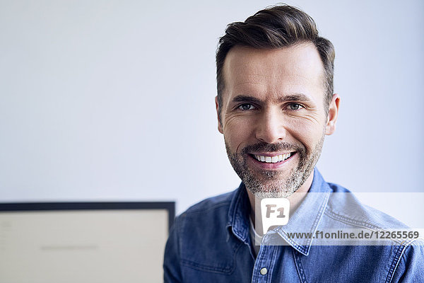 Portrait of smiling man in office