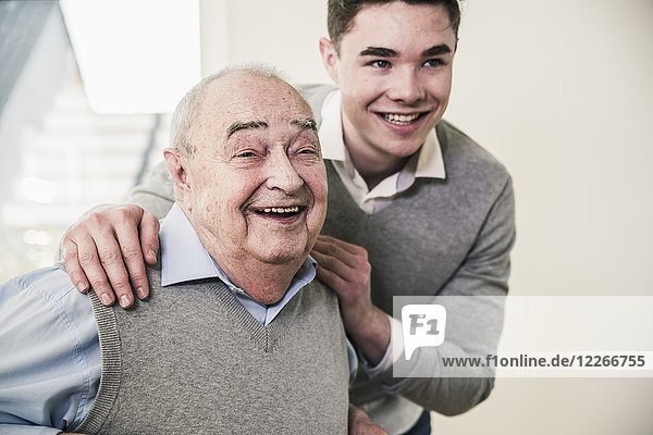 Portrait of happy senior man and young man