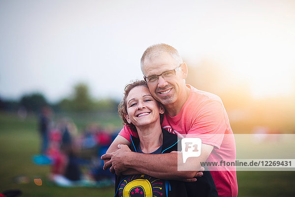 Portrait of couple looking at camera smiling