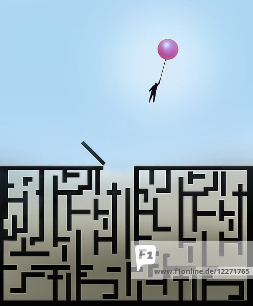 Mann flieht mit Luftballon aus Labyrinth