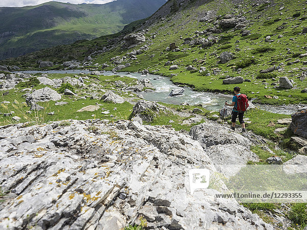 Woman hiking in the High Pyrenees near Pont d'Estaube  France