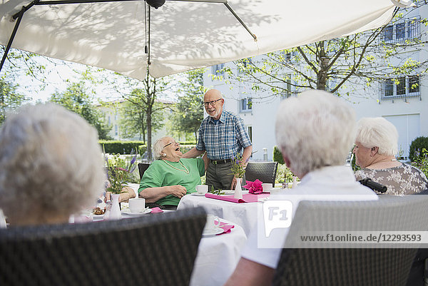 Senior people on breakfast table at nursing home