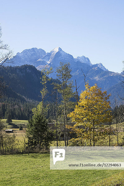 Scenic view of autumn landscape and snowcapped mountain in Bavarian alps Alpspitz Wetterstein Mountain
