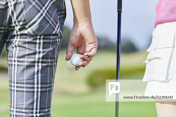 Japanese golf players on course