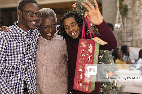 Grandsons surprising grandfather with Christmas gift