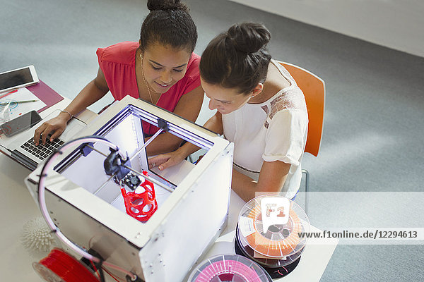 Female designers using 3D printer