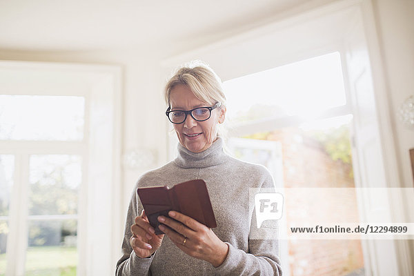 Mature woman reading diary