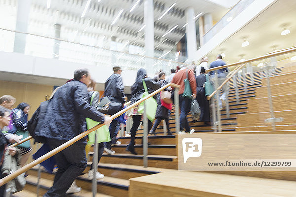 Business people ascending office stairs