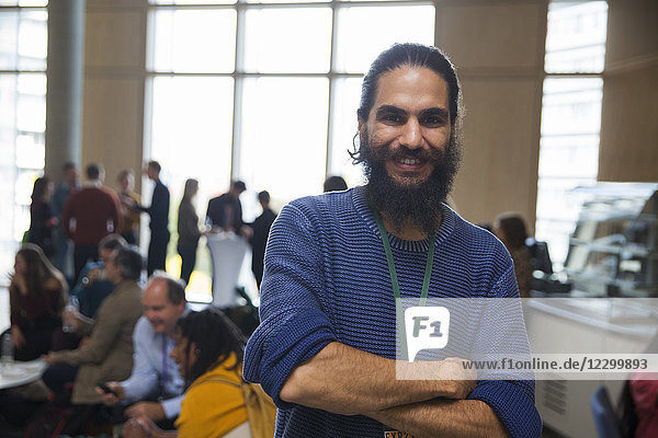 Portrait smiling man with beard at conference