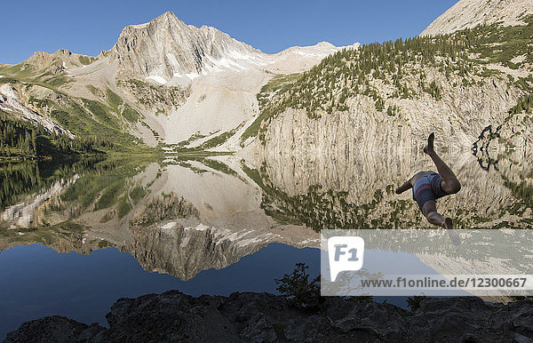 Man diving into Snowmass Lake Maroon Bells Snowmass Wilderness Aspen Colorado USA