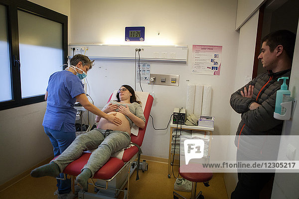Reportage in the maternity  gynecology and obstectrics emergency service in the Métropole Hospital  Chambéry  France. A midwife carries out foetal monitoring on a woman who is 40-weeks pregnant and can’t feel her baby moving as much as the day before.