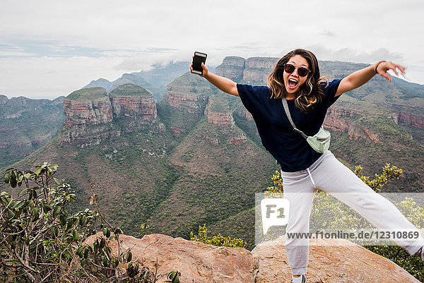 Young female tourist posing on The Three Rondavels  portrait  Mpumalanga  South Africa