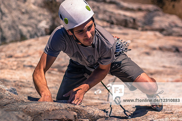 Young man  sport climbing  elevated view  Skaha Bluffs Provincial Park  Penticton  Canada