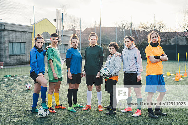 Portrait of football team on pitch