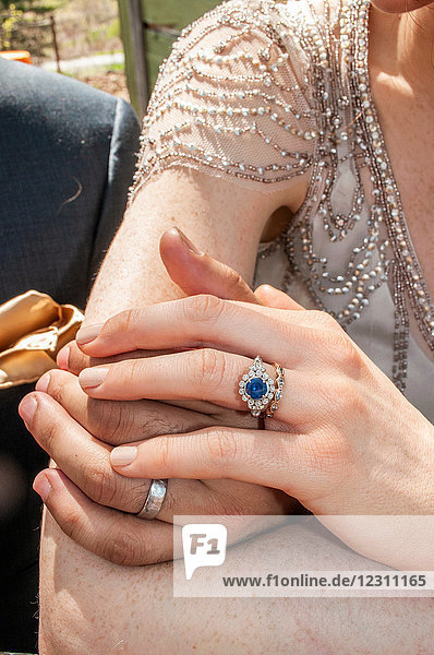 Hands of newlywed couple