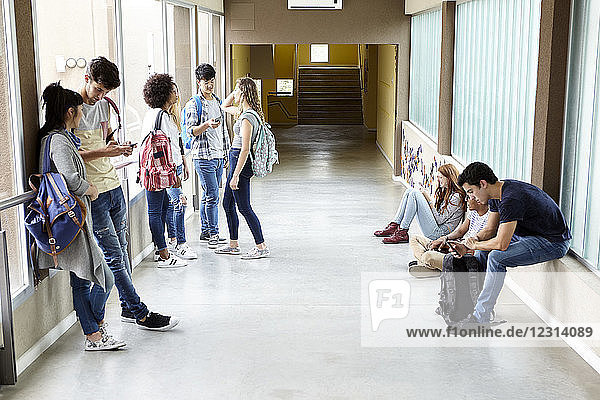 Students killing time in corridor between classes