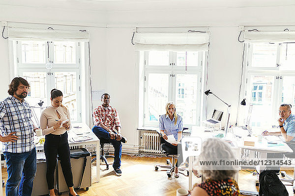 Coworkers during business meeting in office